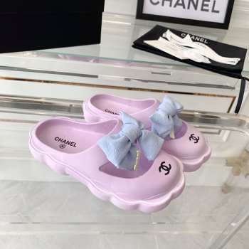 Chanel slippers in pink with bow tie