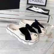 Chanel slippers in white with black bow tie  - 1