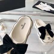 Chanel slippers in white with black bow tie  - 6