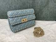 Valentino studded leather crossbody bag in light blue - 1