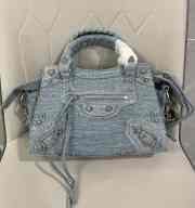 Balenciaga Neo Cagole City Handbag in blue washed and frayed denim, aged-silver hardware with rhinestones - 1