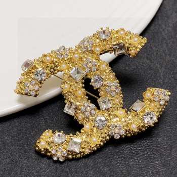 Chanel brooch golden pearl 