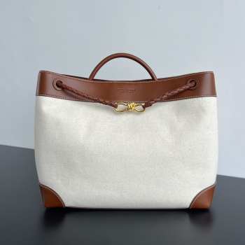 Uubags | Andiamo top handle bag in weathered leather and canvas with signature knot