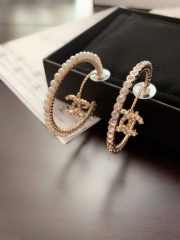 Uubags | Chanel Moon Pearl earrings made of consistent brass material - 2