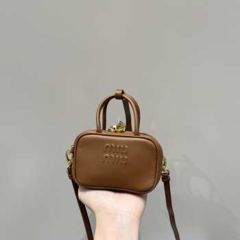 Uubags | Miu Miu leather micro bag in brown 10.5x4cm