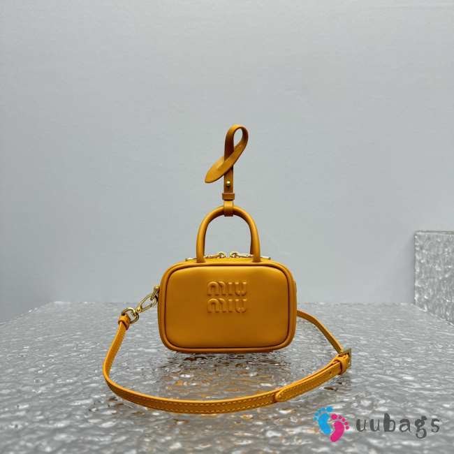 Uubags | Miu Miu leather micro bag in yellow 10.5x4cm - 1