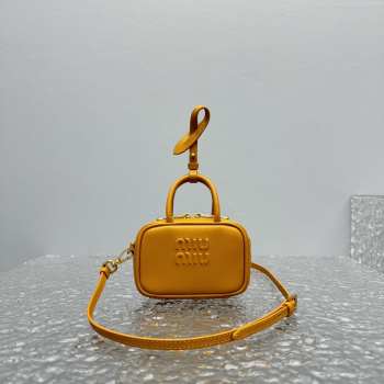 Uubags | Miu Miu leather micro bag in yellow 10.5x4cm