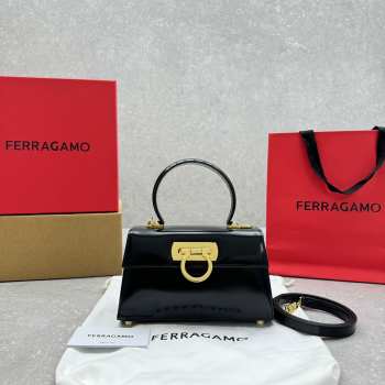 Uubags | Ferragamo Iconic top handle black bag in brushed-off calfskin with a gold Gancini clasp 21x8x12cm