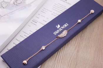 Uubags | Swarovski rose-gold tone plated feather strand bracelet